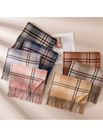 Seven plaid scarf colors arranged together with their fringed edges visible