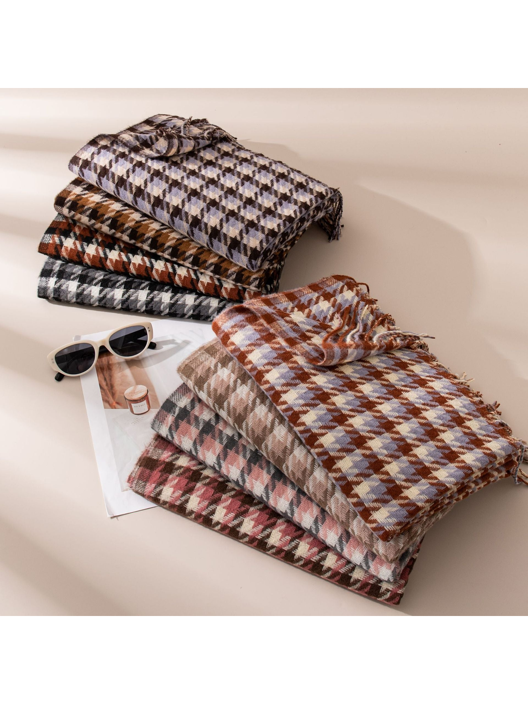 Houndstooth scarves in eight colors arranged in two folded stacks