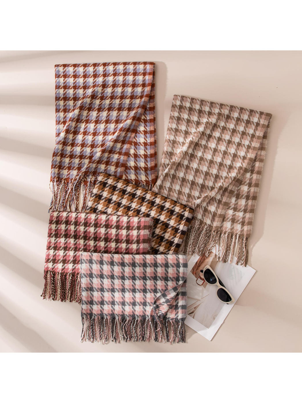 Five houndstooth scarf colors arranged with visible fringe