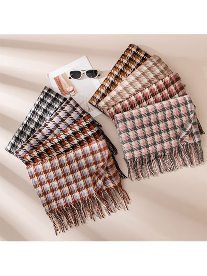 Eight houndstooth scarves fanned out with fringed ends visible