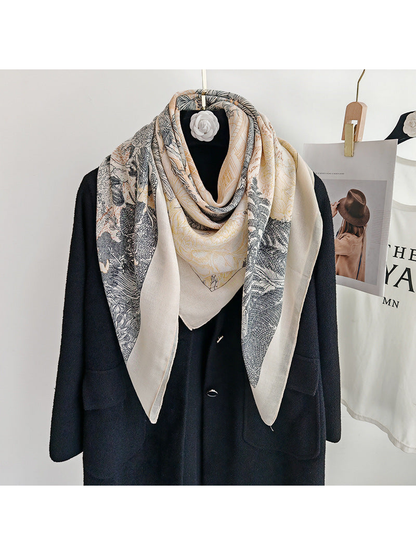 Cream botanical square scarf styled in a layered neck drape