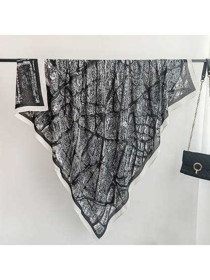 Black-base square scarf with white city-map print and contrasting border