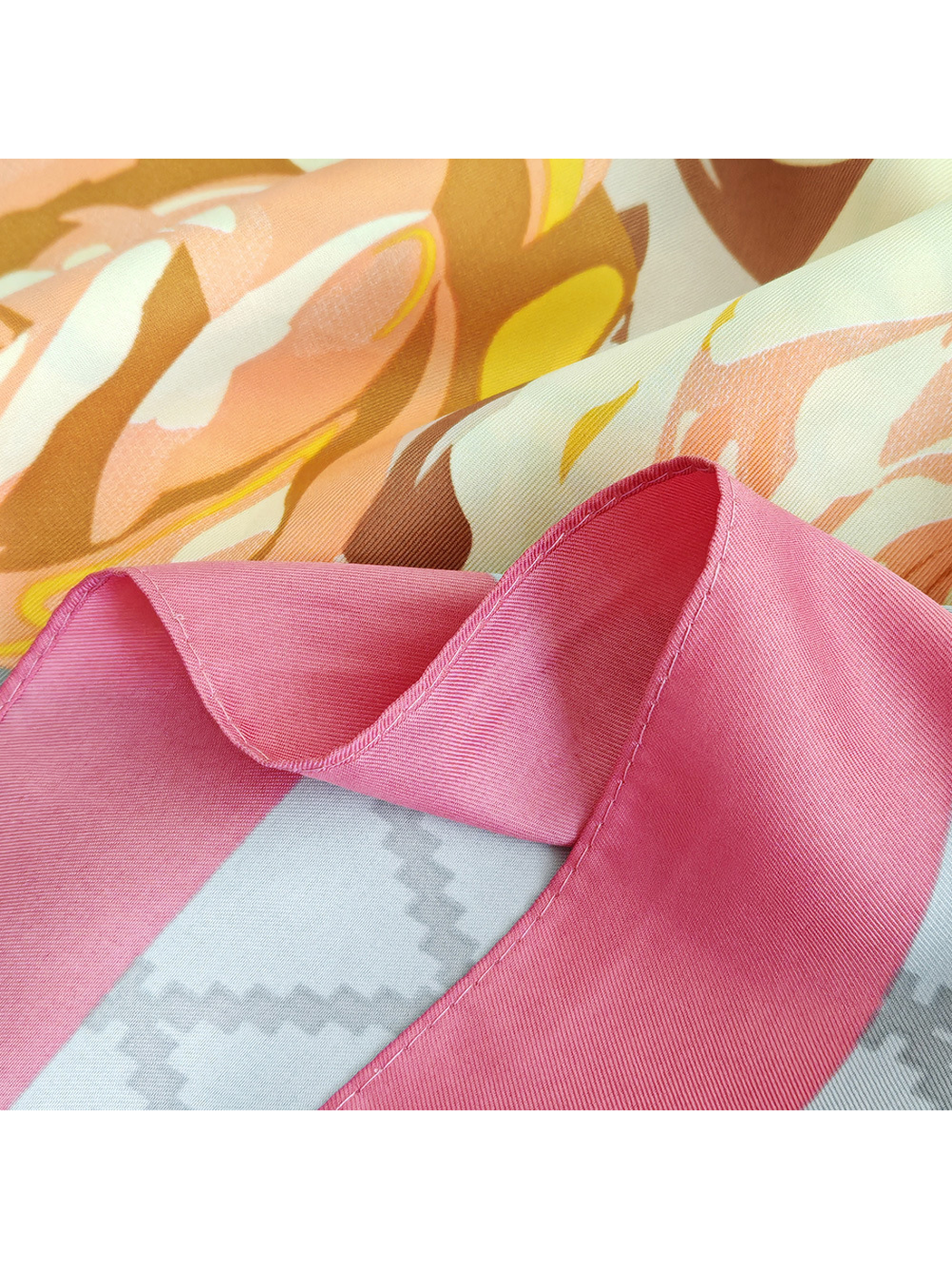 Close-up of the pink border and narrow stitched edge