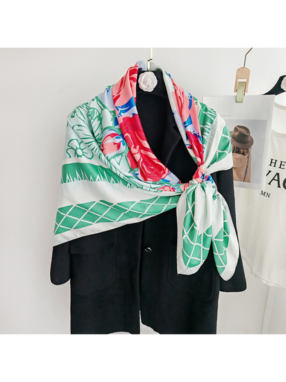 Green floral square scarf styled in an asymmetric side knot