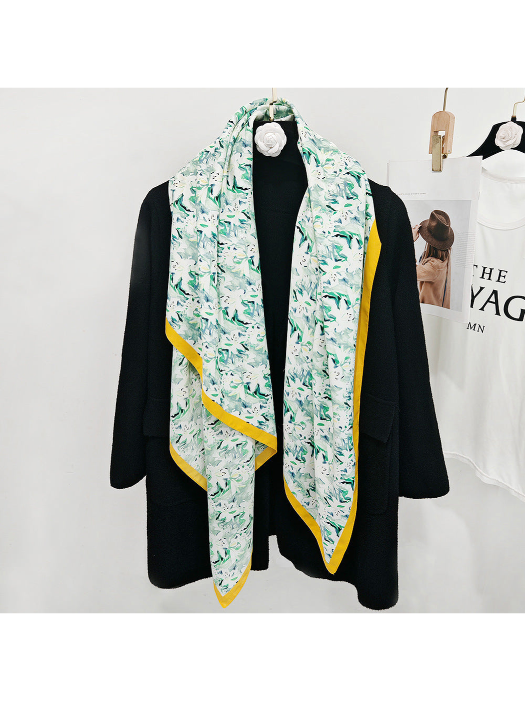 Mint abstract floral square scarf styled in a long drape over a black coat