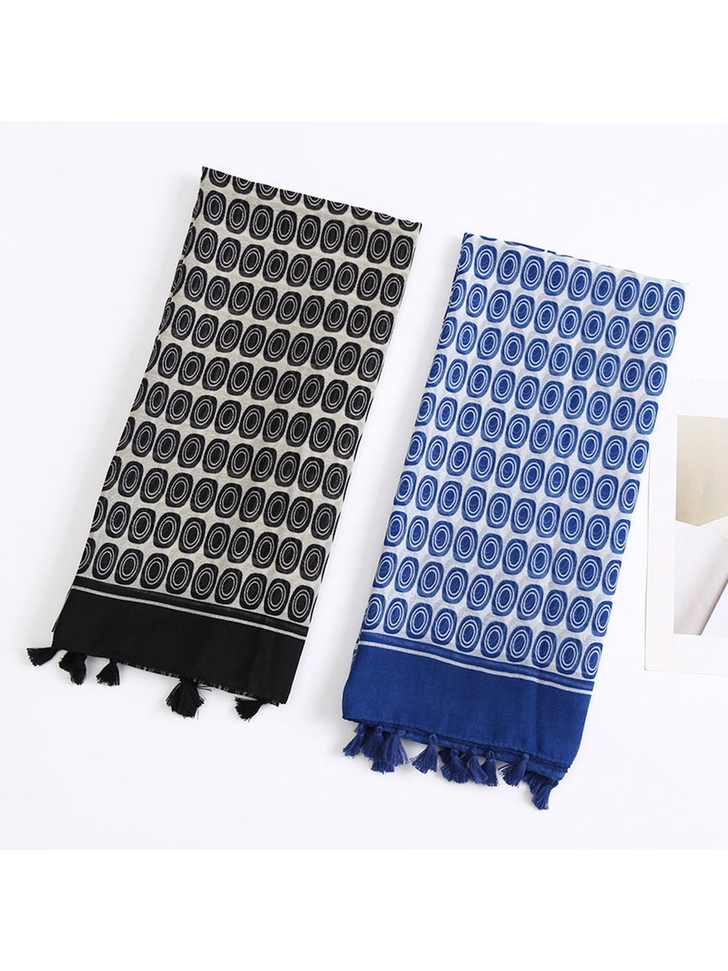 Black and navy oval-pattern scarves displayed together
