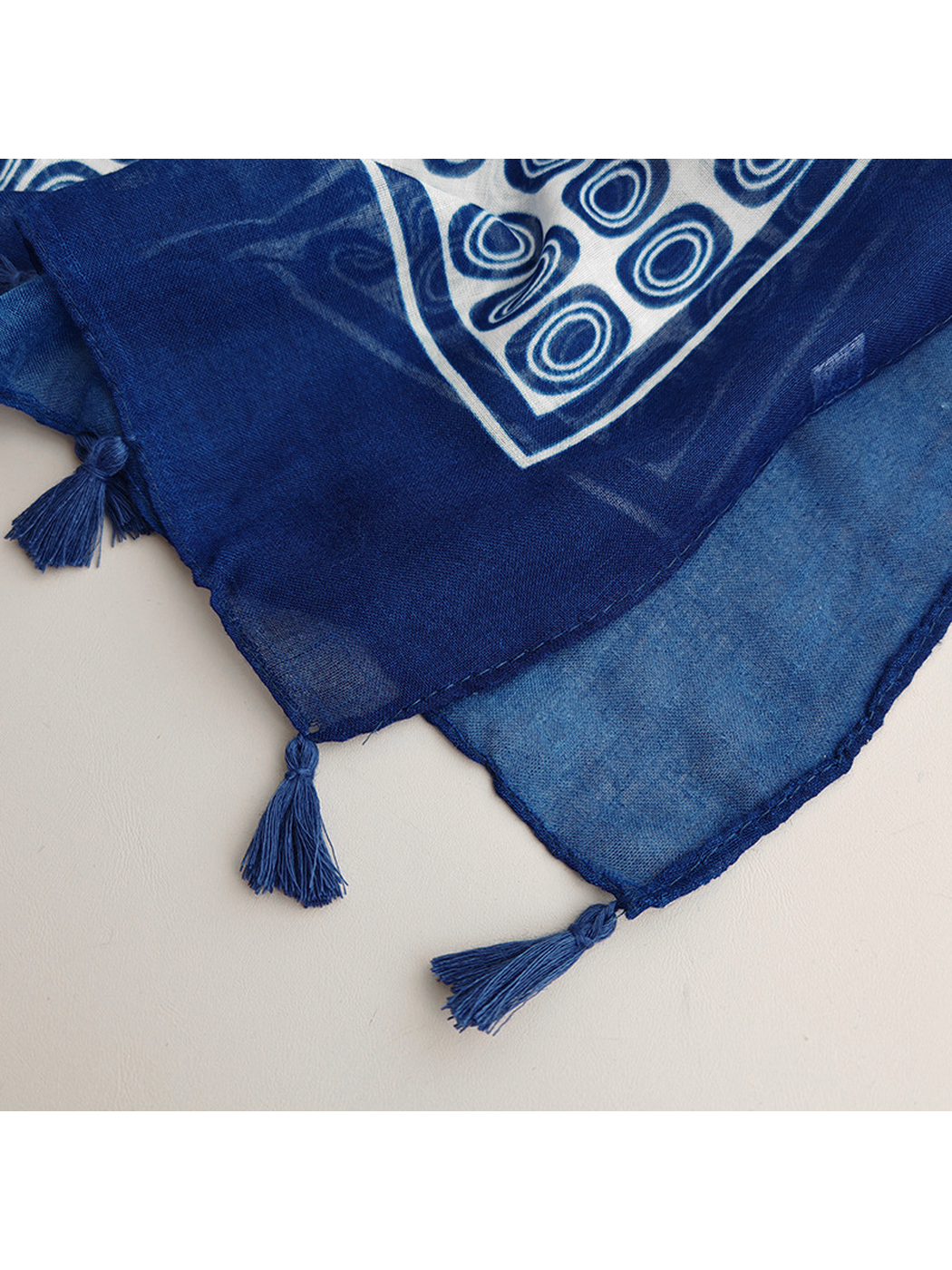 Close-up of the navy border and spaced tassels