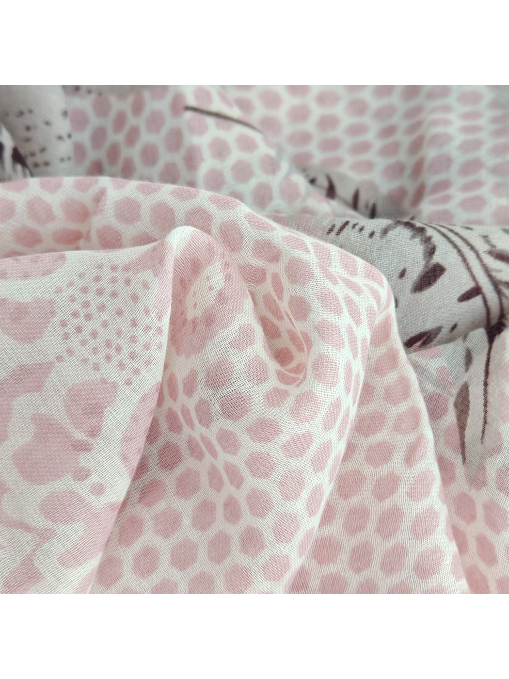 Close-up of the scarf's fine semi-sheer weave and dotted pattern
