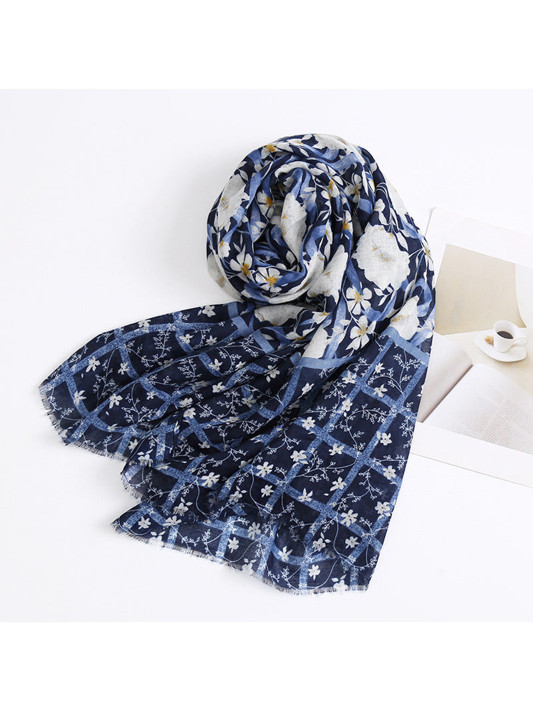 Navy floral scarf arranged in a loose draped view