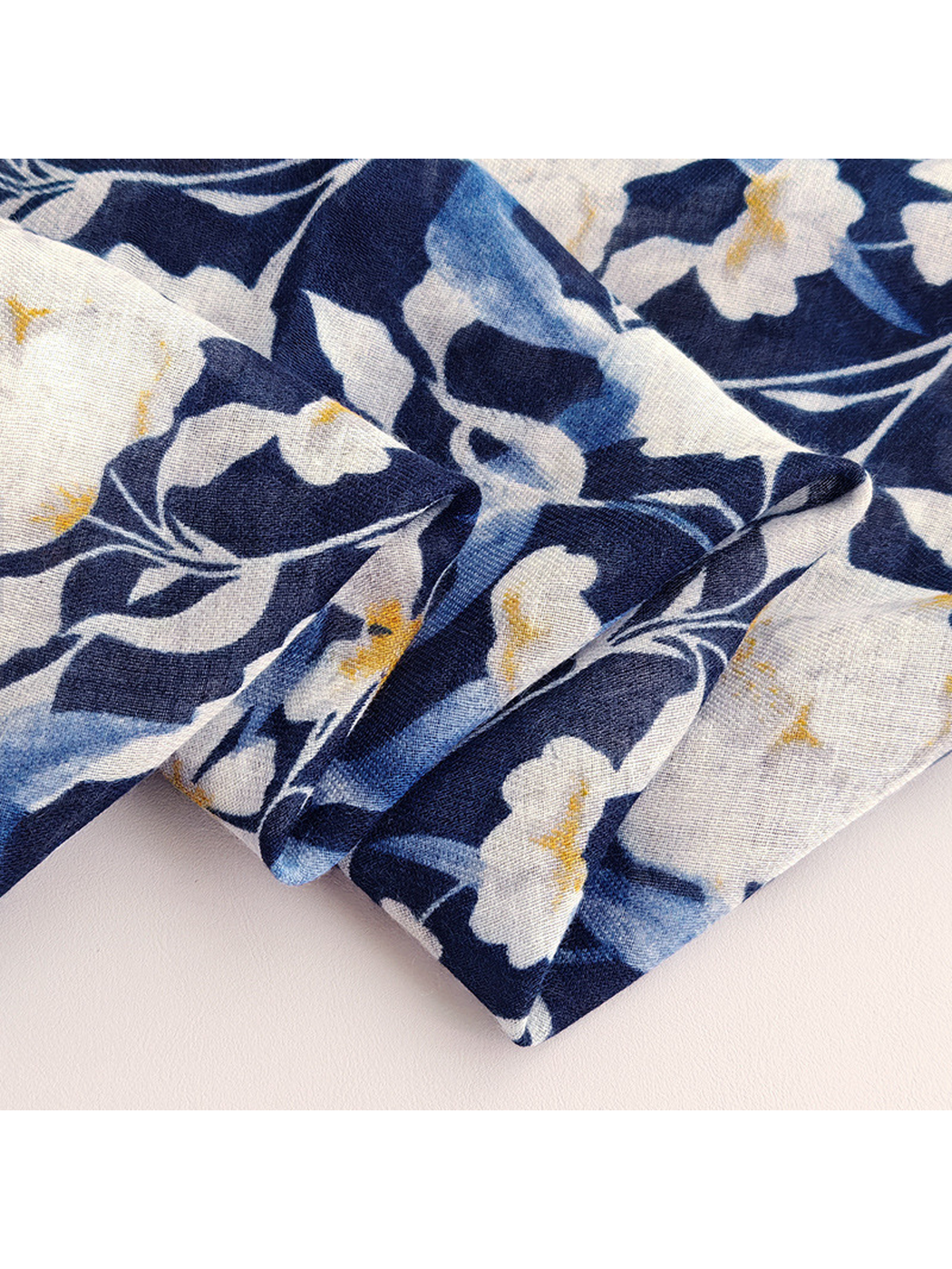 Close-up of the narrow finished edge and white floral pattern