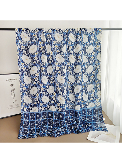 Navy floral rectangular scarf displayed fully open with its contrasting border