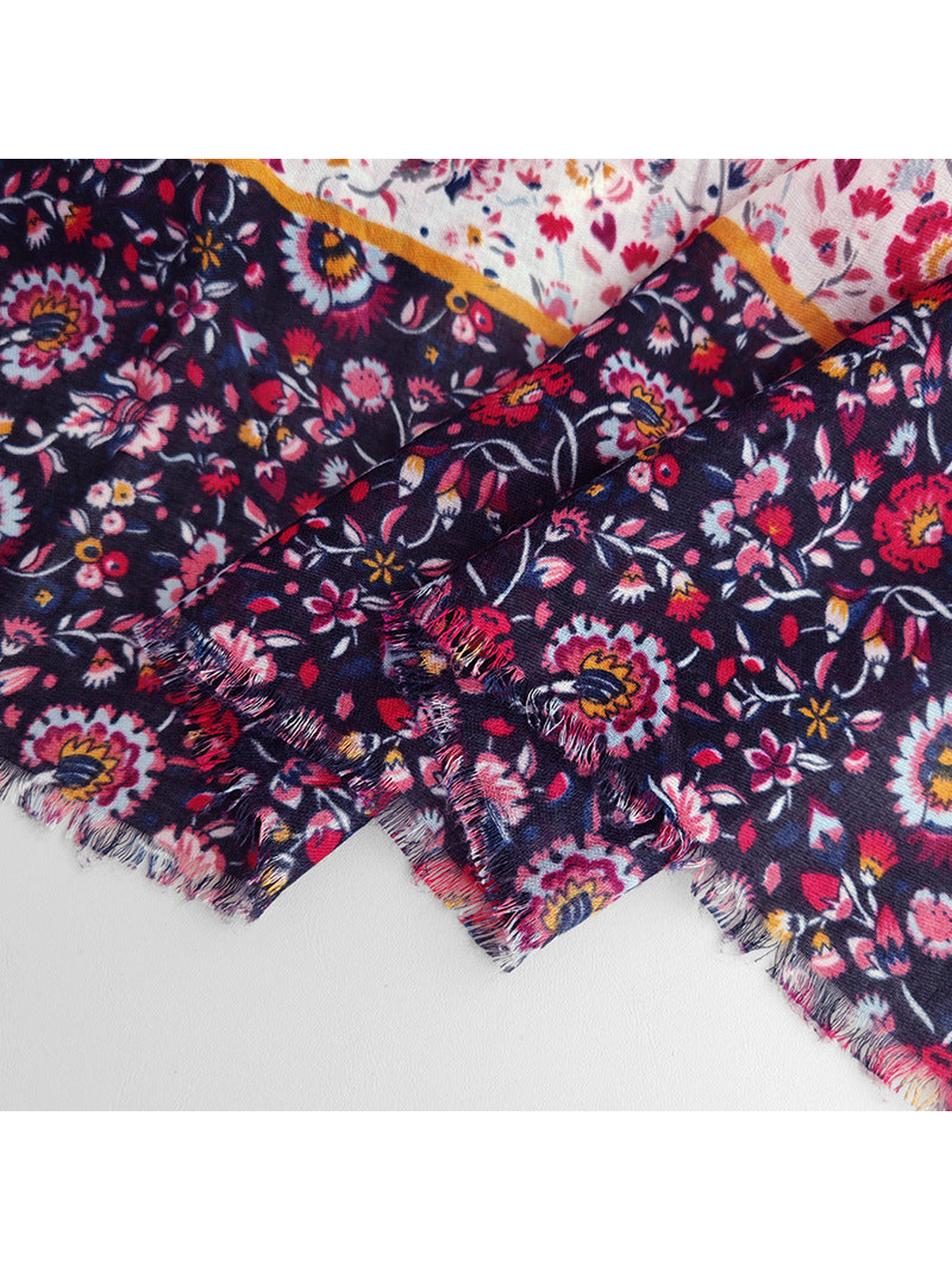 Close-up of the navy floral border and short fringed edge