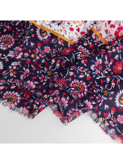 Close-up of the navy floral border and short fringed edge