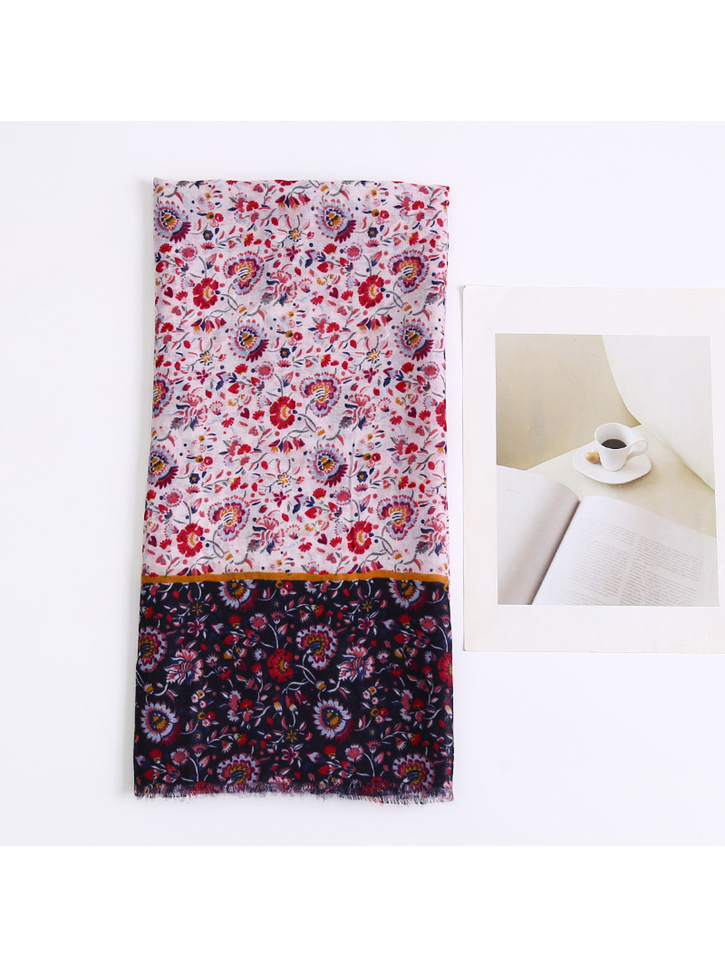 Folded floral scarf showing the pale center and navy border