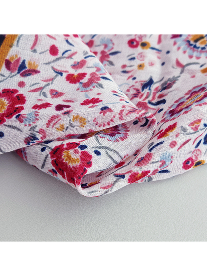 Close-up of the lightly translucent pale floral section in overlapping folds
