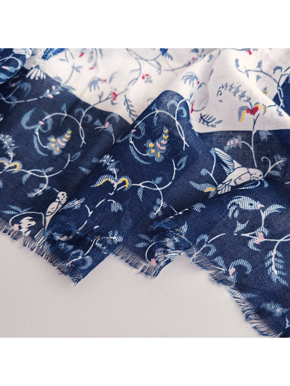 Close-up of the navy patterned border and short fringed edge