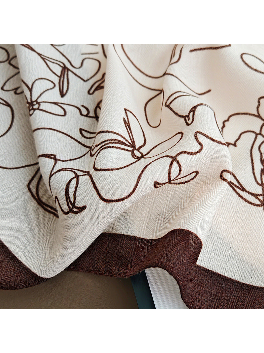 Close-up of the brown line-art pattern and fine surface texture