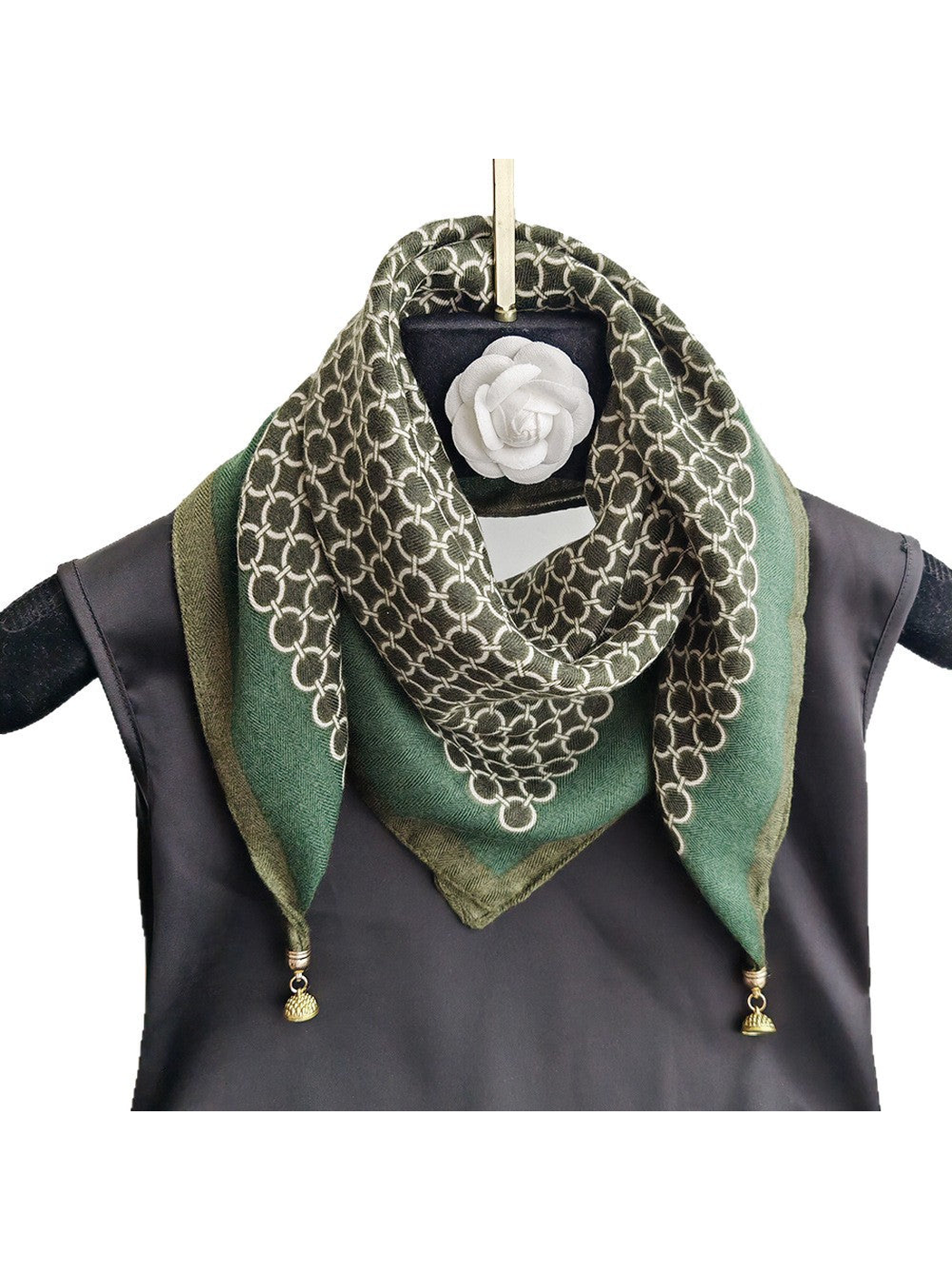 Green square scarf with a contrasting ring pattern, styled front view