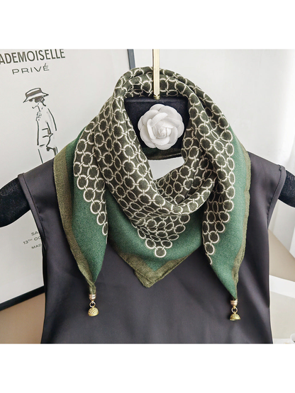 Green square scarf styled around a display stand