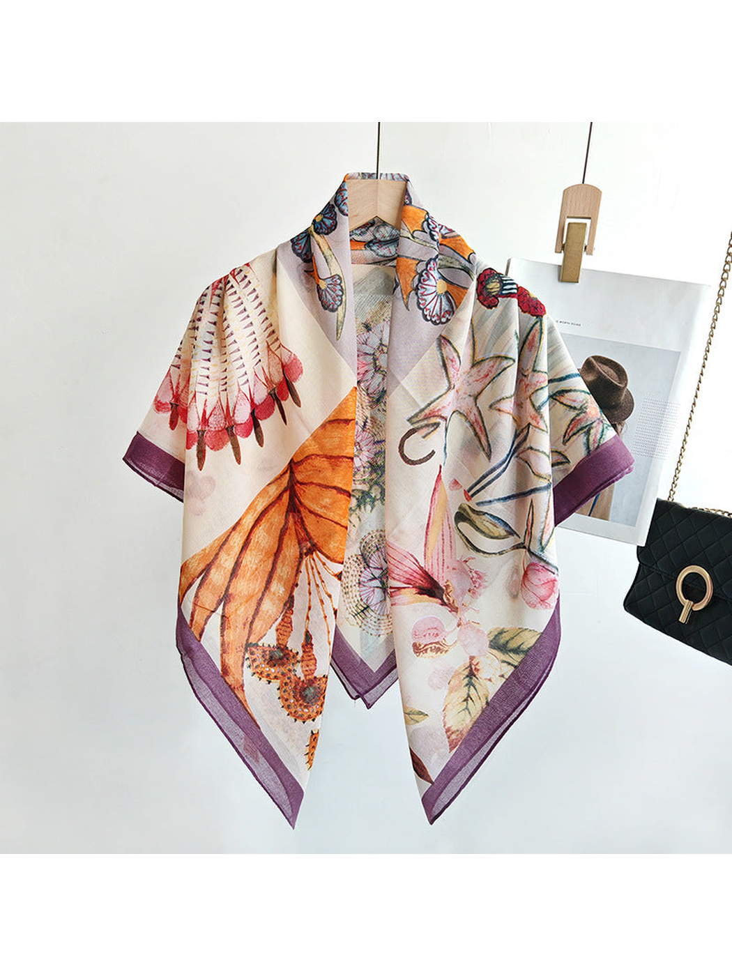 Multicolor square scarf draped open on a hanger