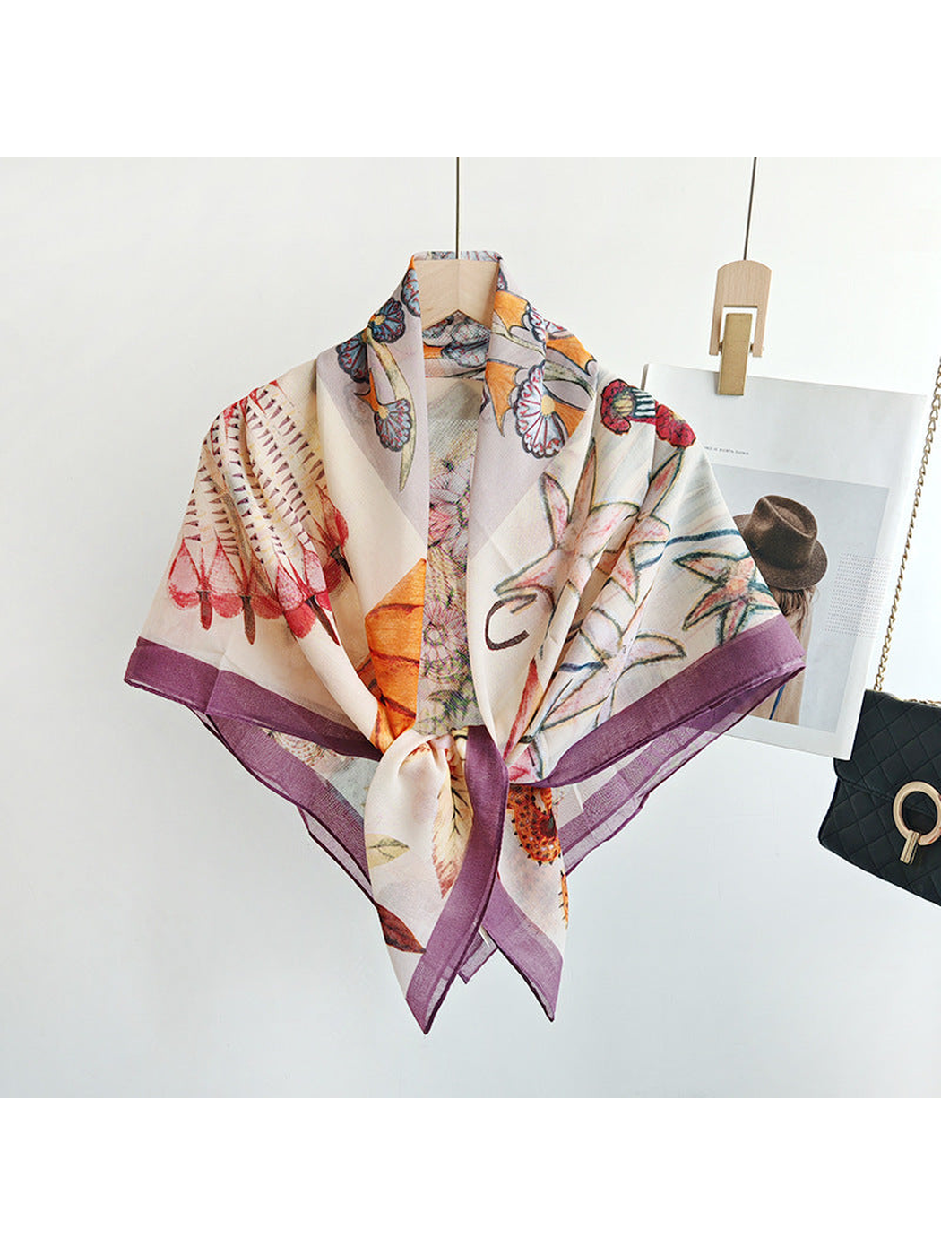 Multicolor square scarf tied at the front on a hanger