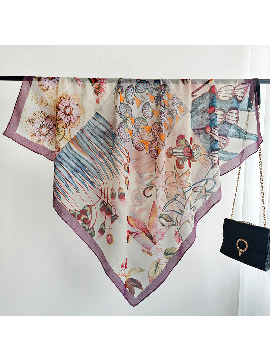 Multicolor square scarf displayed open with a purple border