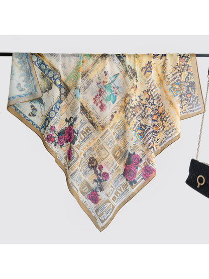 Multicolor square scarf displayed open over a hanging rail