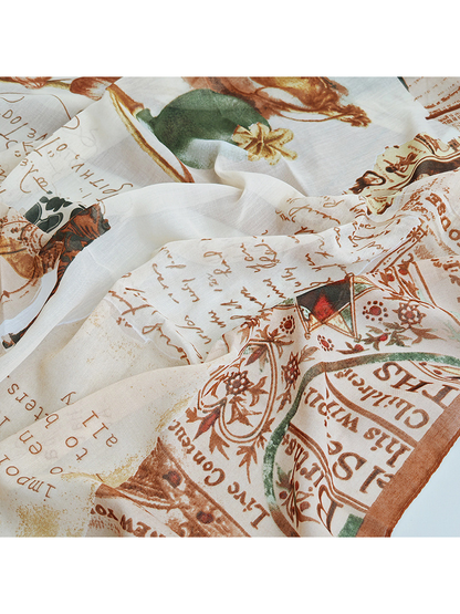 Close-up of the vintage collage print with script and botanical motifs