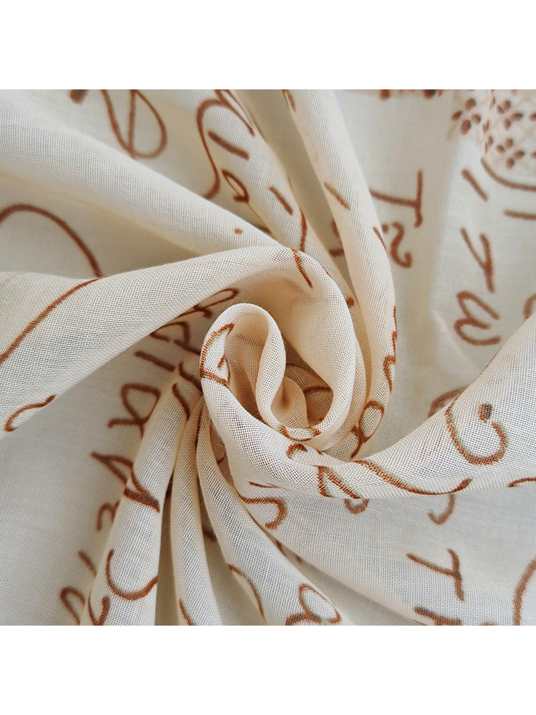 Close-up of the fine semi-sheer grid texture and printed script