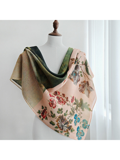 Botanical and landscape print scarf draped over a mannequin