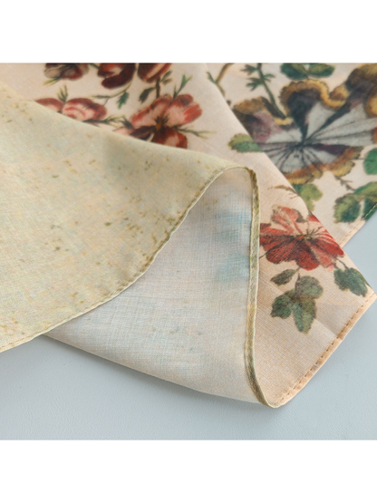 Close-up of the scarf's stitched edge and printed reverse side