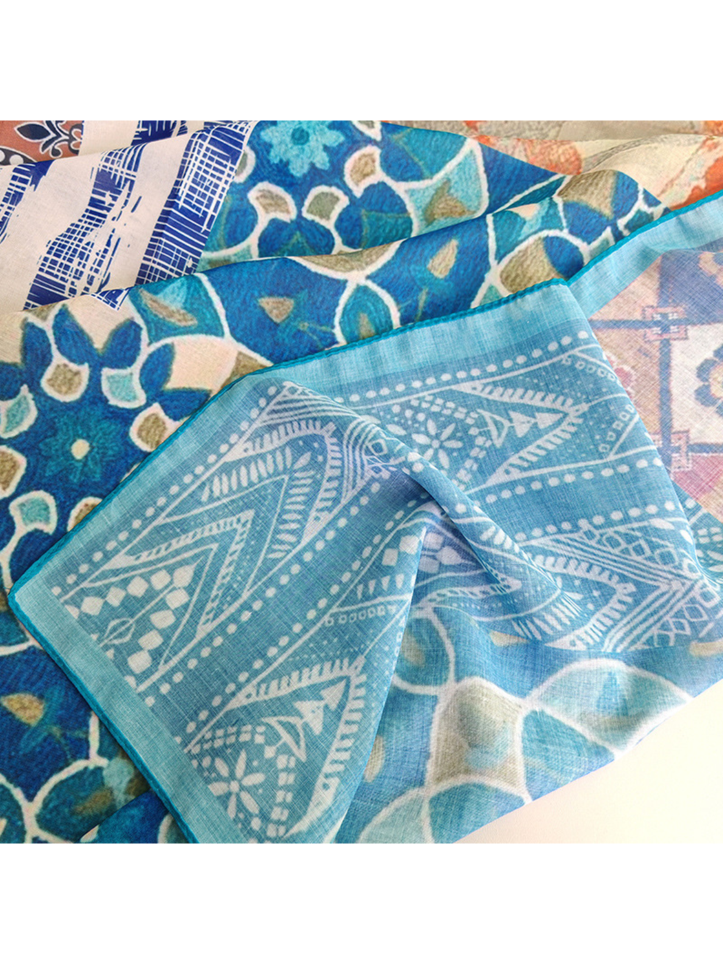 Close-up of the multicolor scarf's semi-sheer patterned surface