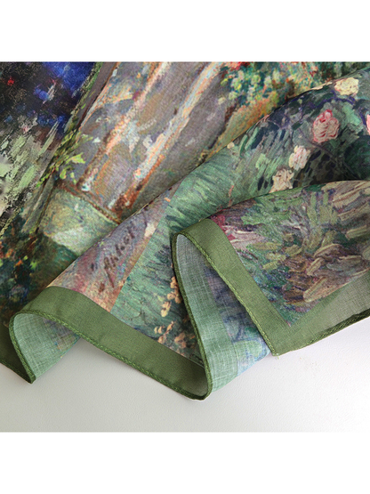 Close-up of the scarf print, green border and folded edge