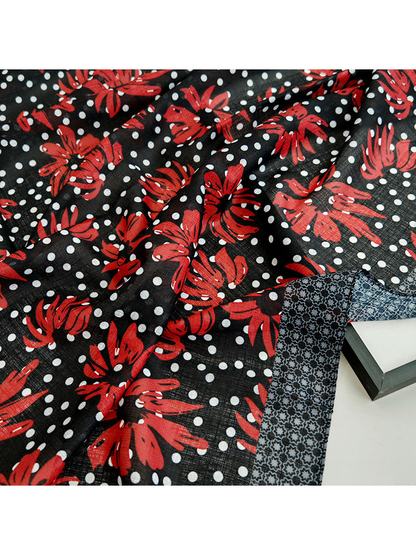 Close-up of the scarf's semi-sheer texture and red floral print