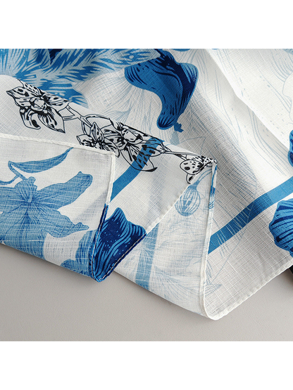 Close-up of the scarf's floral print and stitched edge