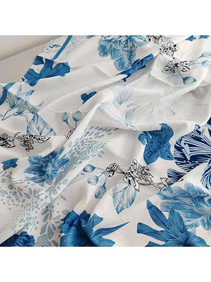 Close-up of the scarf's floral print and fine crosshatched texture