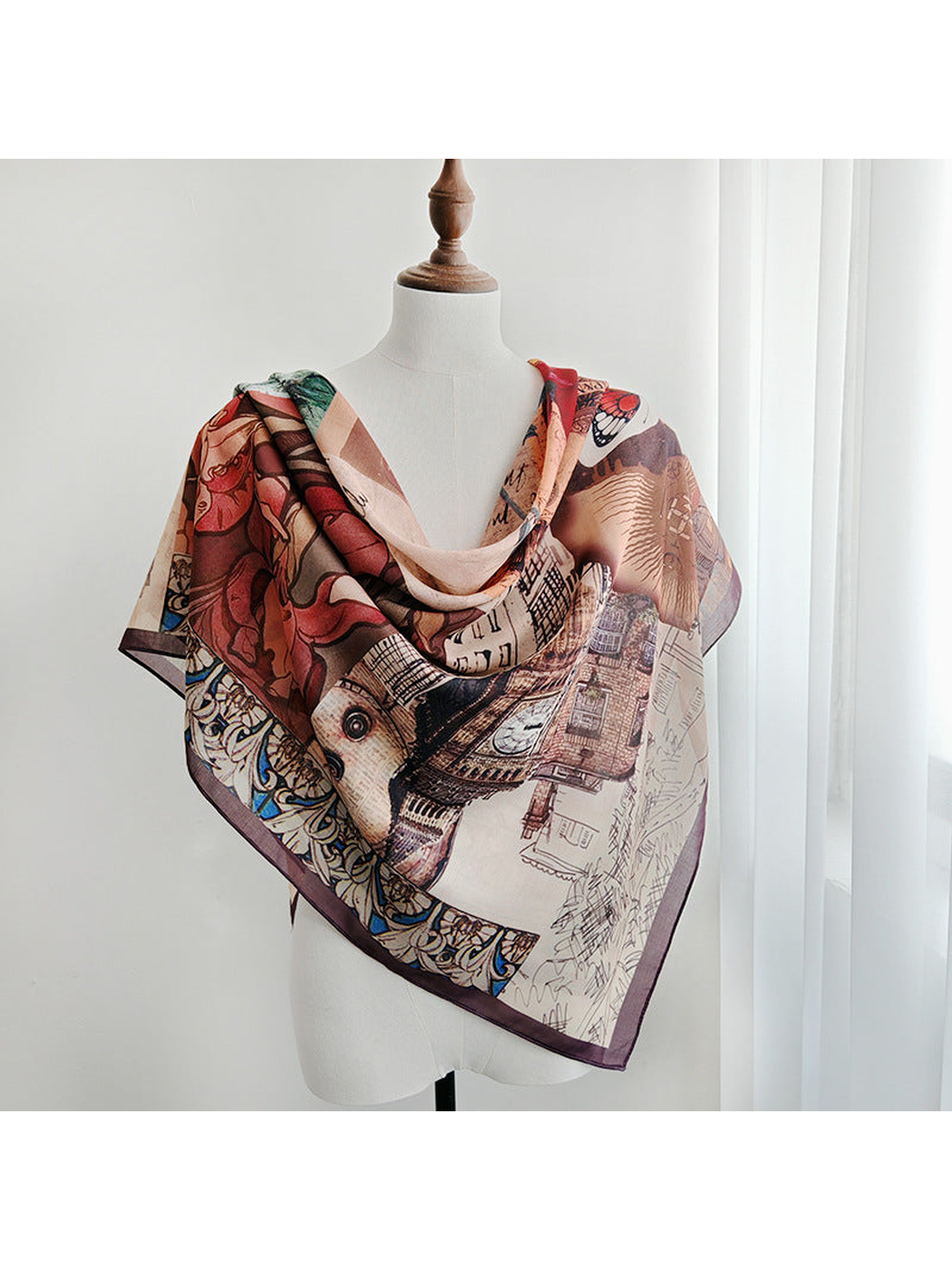 Multicolor square scarf draped around a dress form