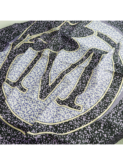 Close-up of the central circular motif and abstract speckled print