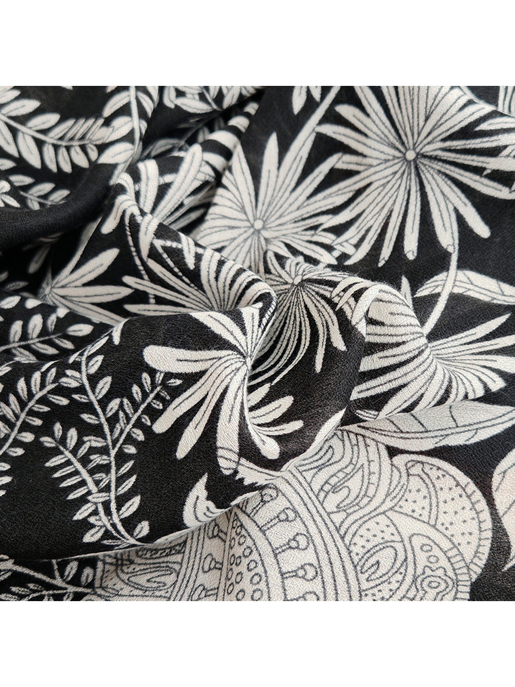 Close-up of the black and white botanical print and fine woven-look texture