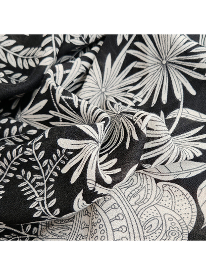Close-up of the black and white botanical print and fine woven-look texture