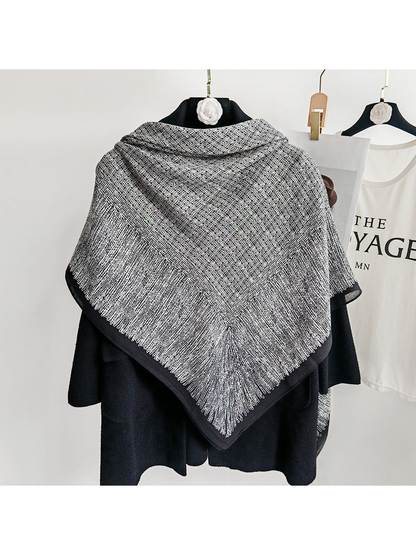 Black and gray square scarf displayed across the back of a black coat