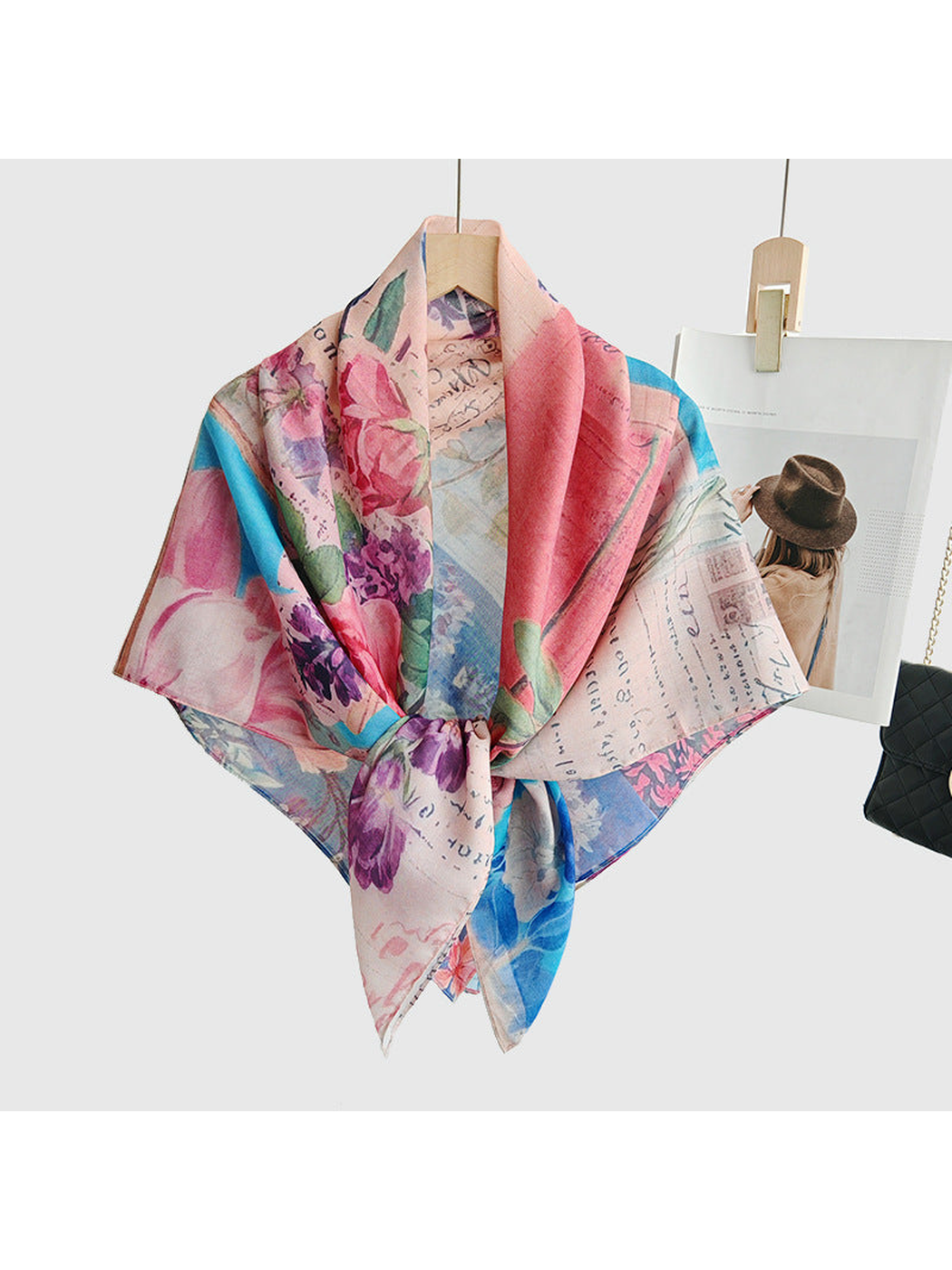 Multicolor floral square scarf tied at the front on a hanger