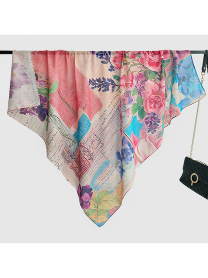 Multicolor floral square scarf displayed over a horizontal rail