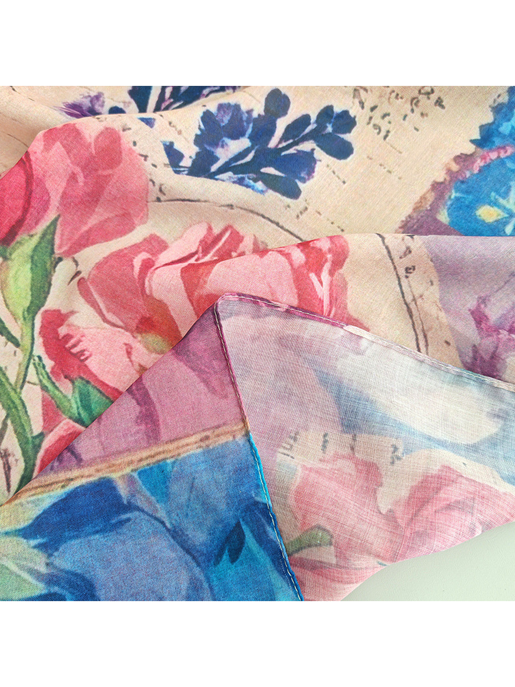 Close-up of the scarf's narrow stitched edge and semi-sheer finish