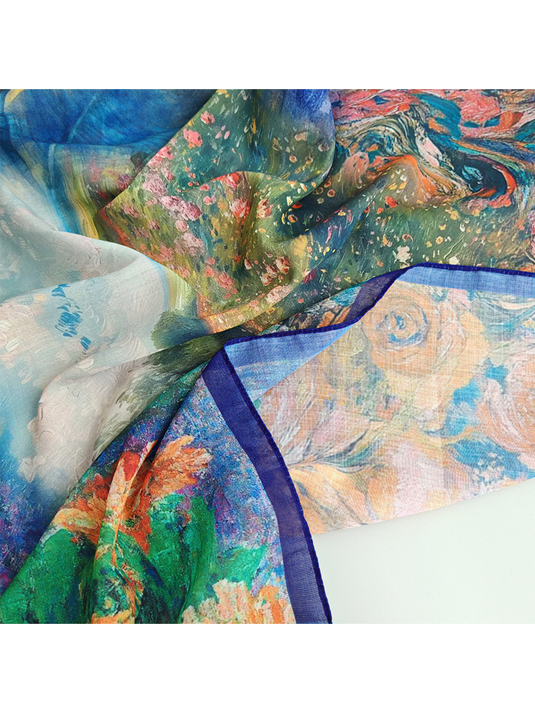 Close-up of the scarf's semi-sheer floral print and navy border