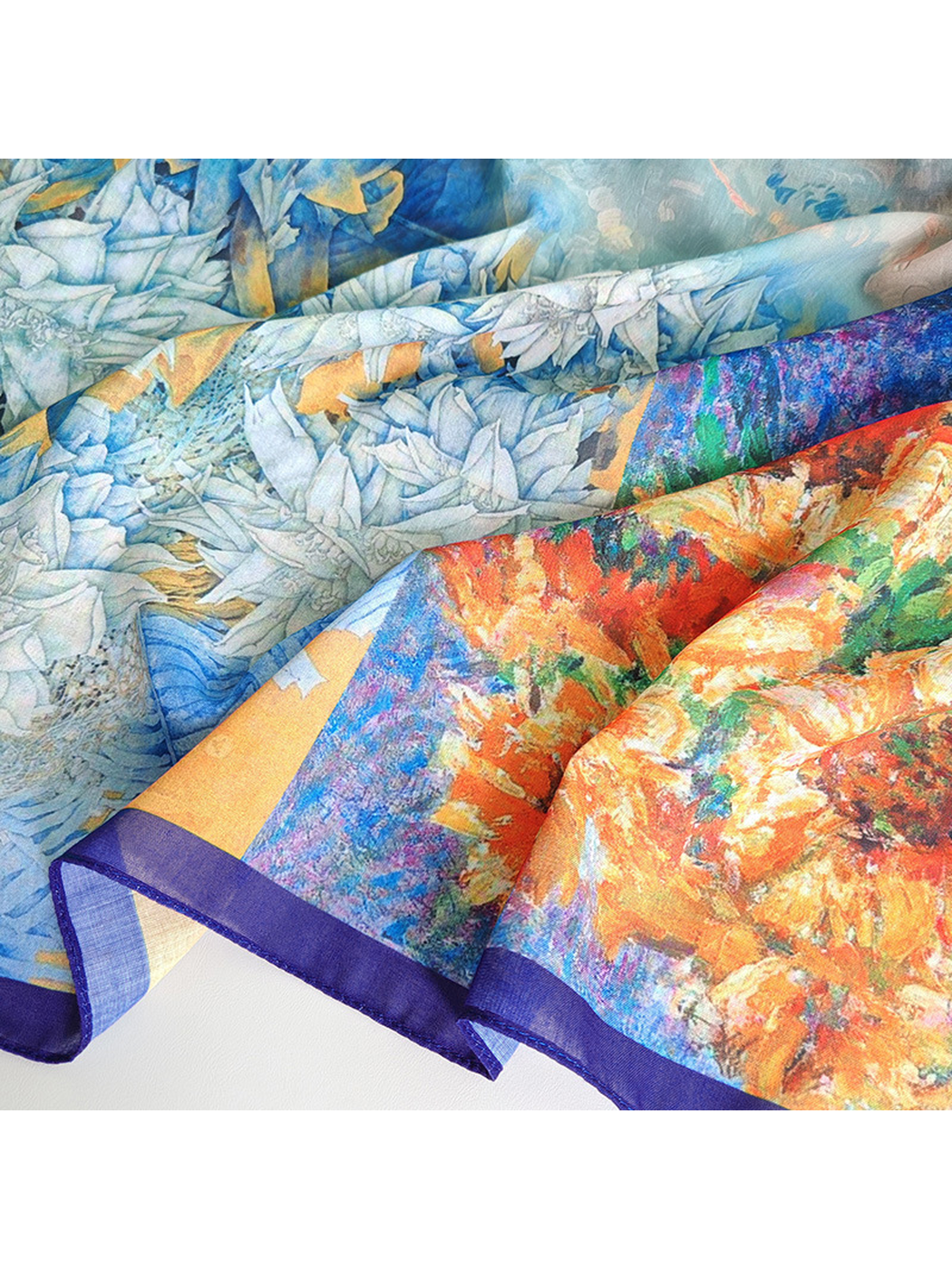 Close-up of the scarf's blue, white and orange floral sections