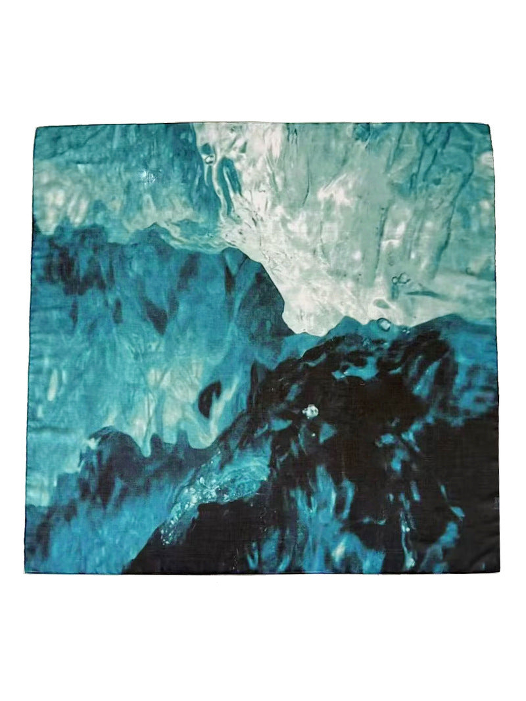 Square scarf laid flat to show its aqua, teal, navy and charcoal abstract pattern
