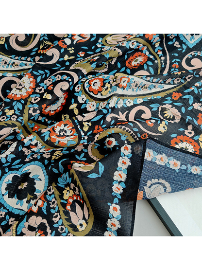 Close-up of the paisley print and fine semi-sheer crosshatched texture
