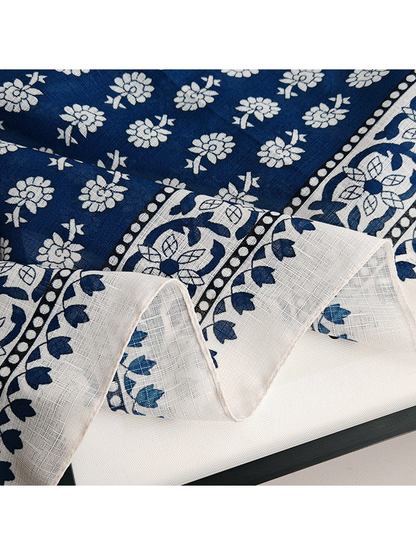 Close-up of the floral print, ornamental border and fine crosshatch texture