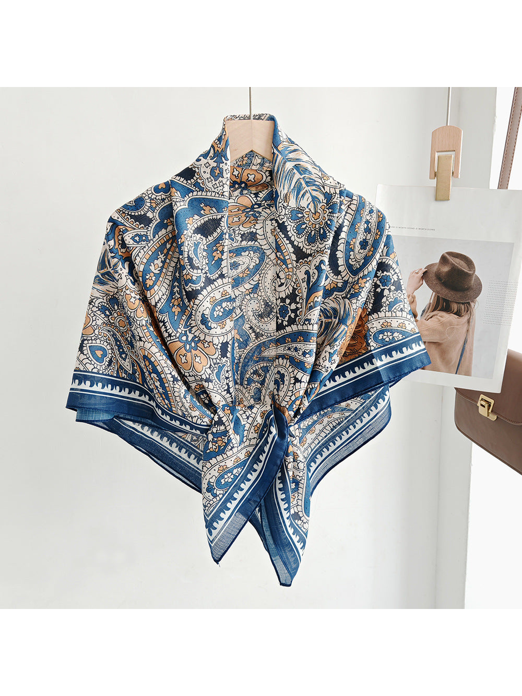Blue, cream and brown paisley square scarf styled in a front knot